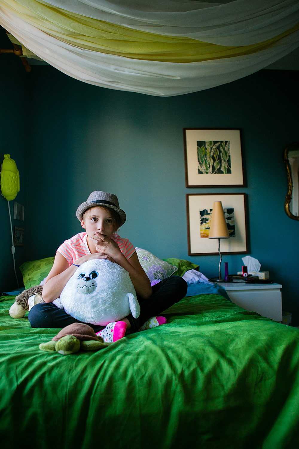 Editorial portrait of a tween girl in her bedroom 