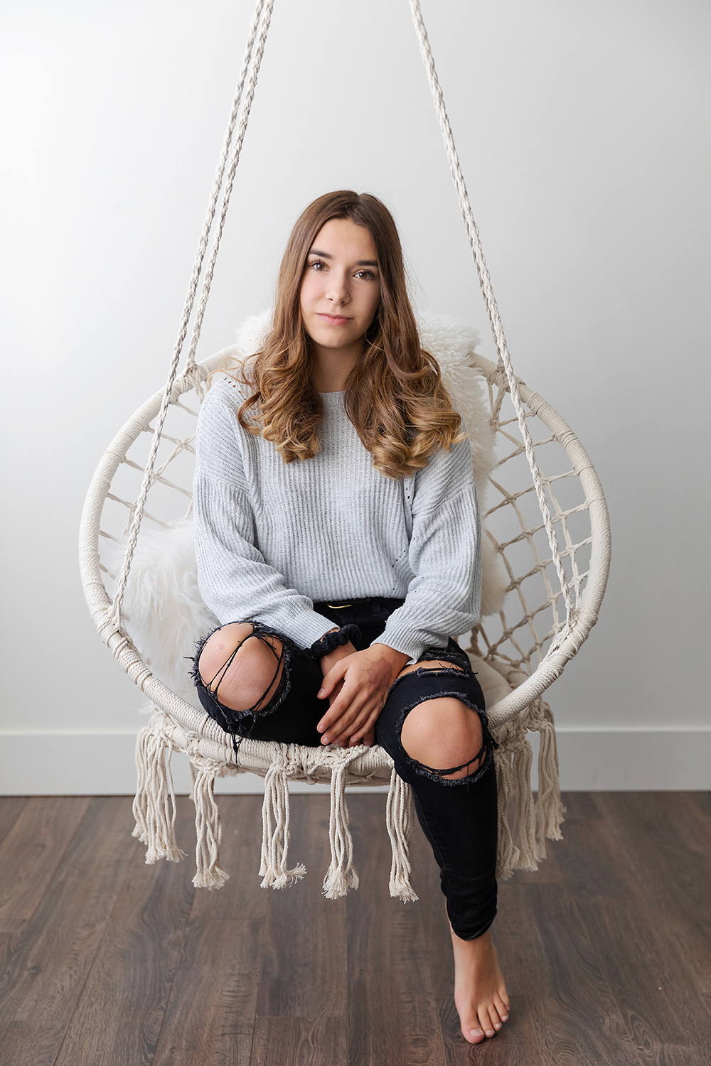 Teen girl on a crochet swing by photographer, Dana Pugh