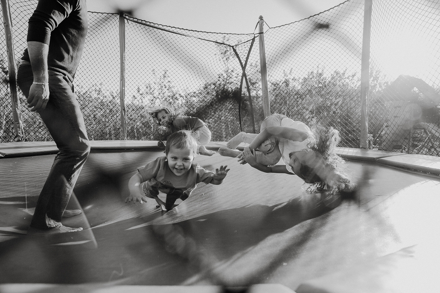 Family playing on the trampoline