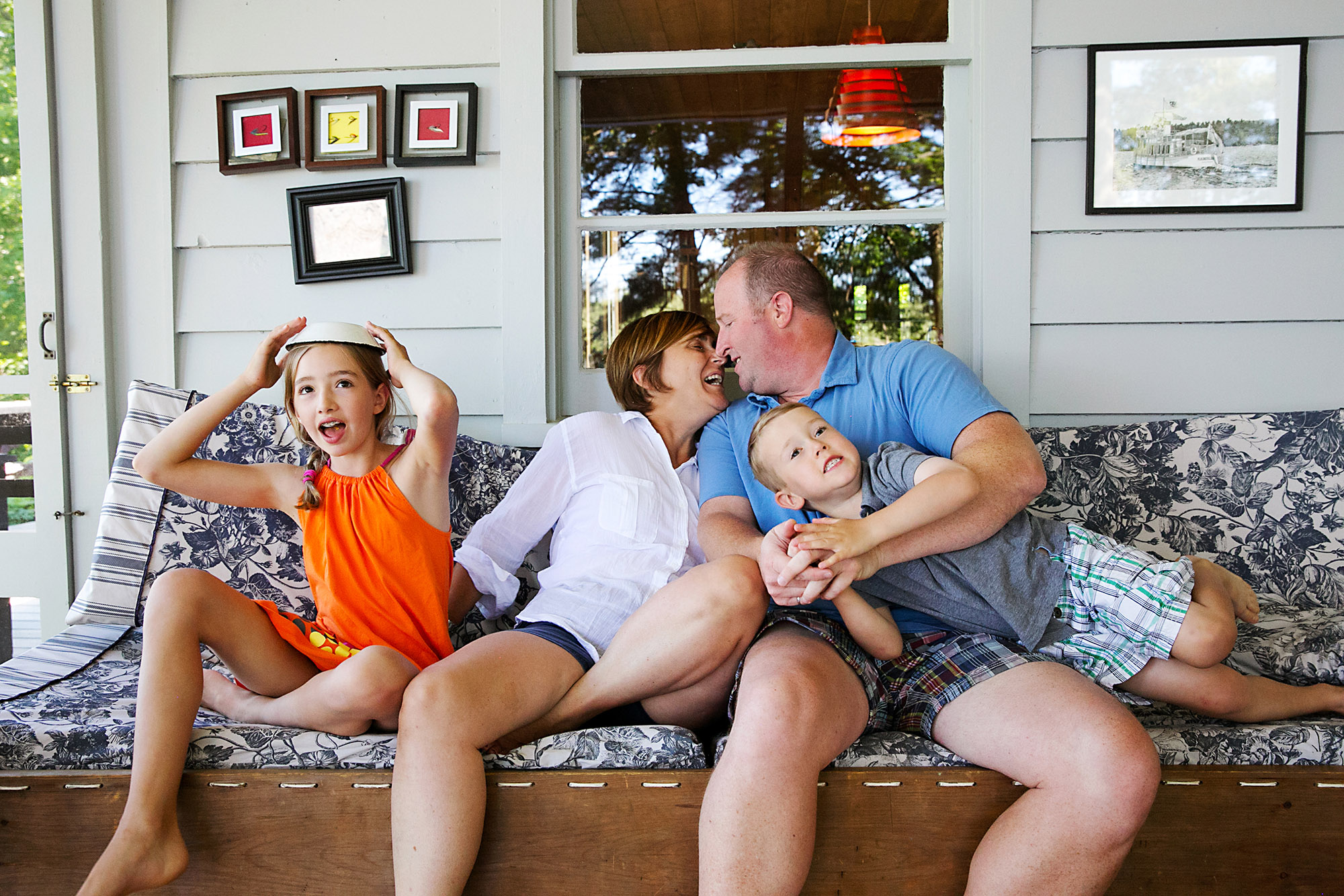 Fun family portrait on the front porch of their cabin in Ontario