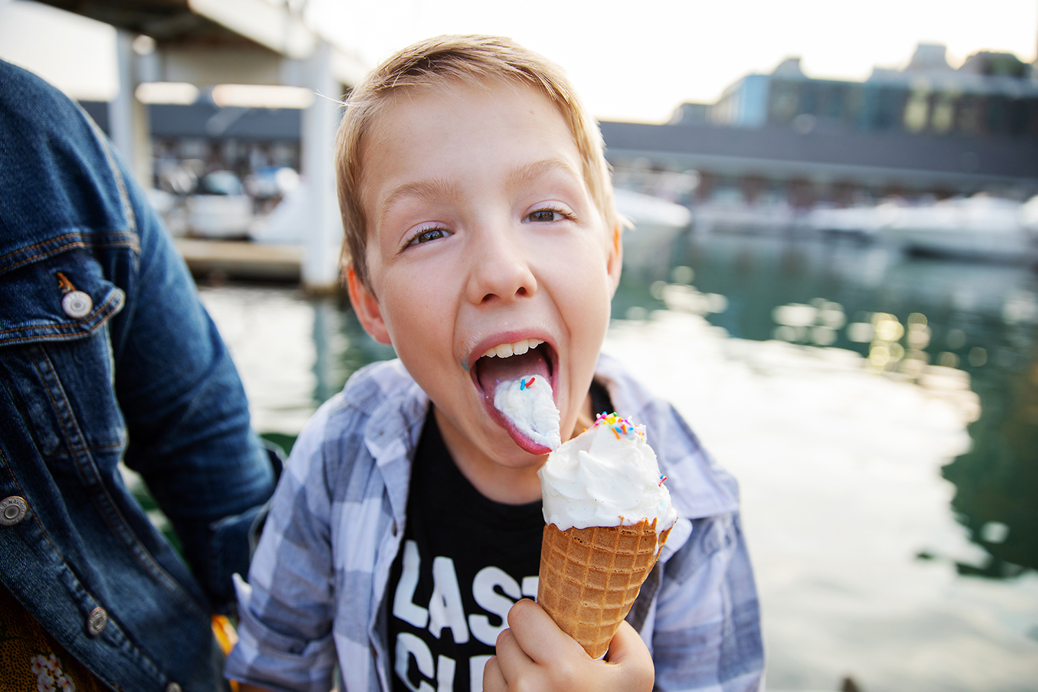 Boy eating ice cream in Toronto by Dana Pugh