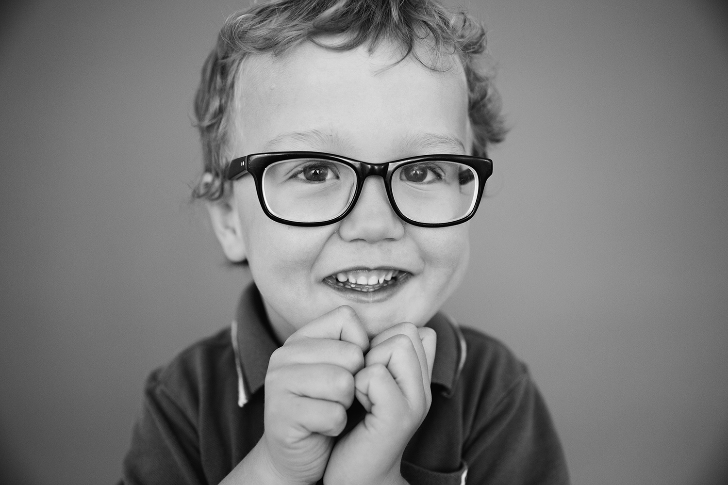 Cute portrait of a boy with glasses by Dana Pugh