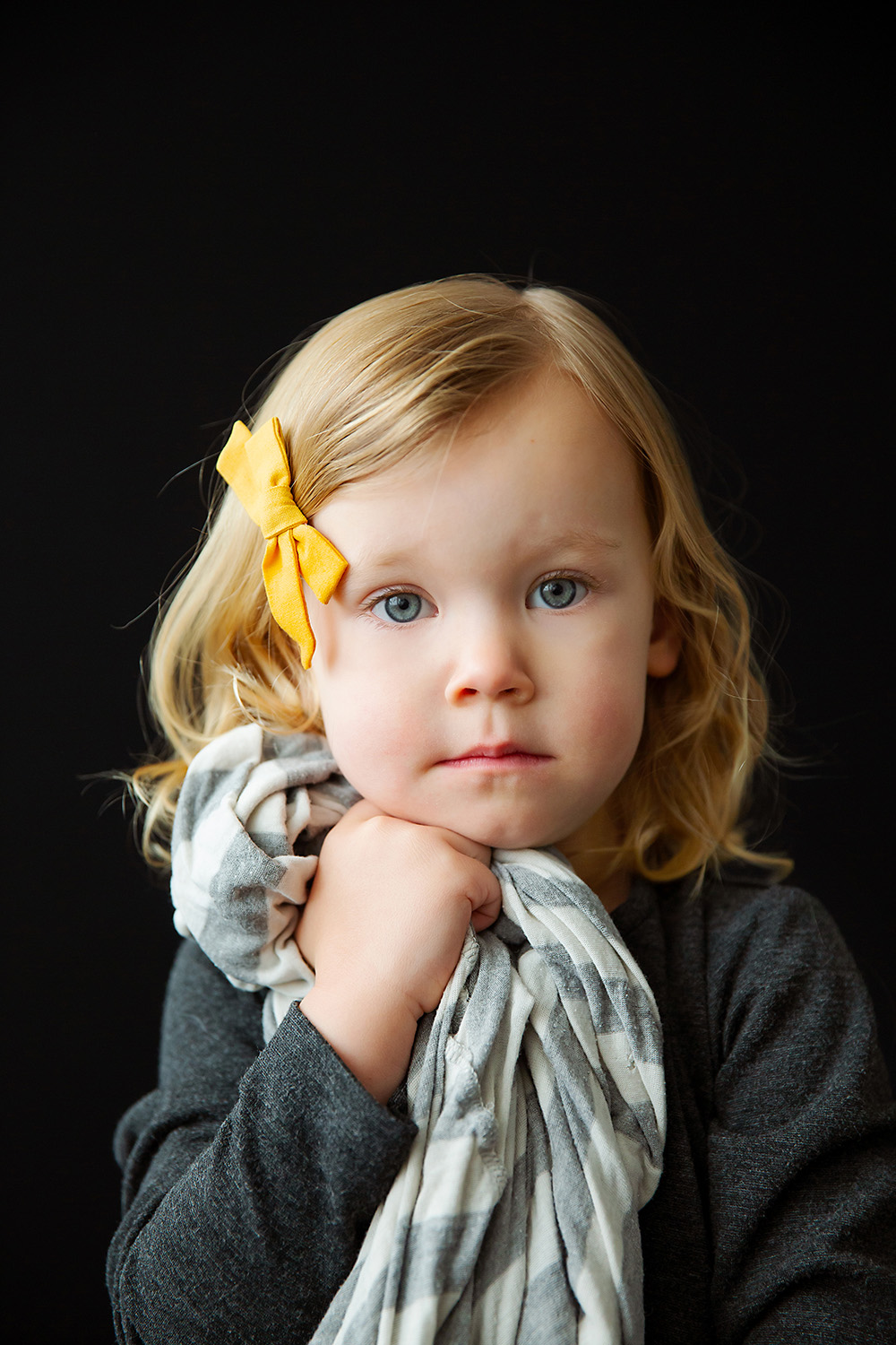 Studio portrait of a child with her blanket