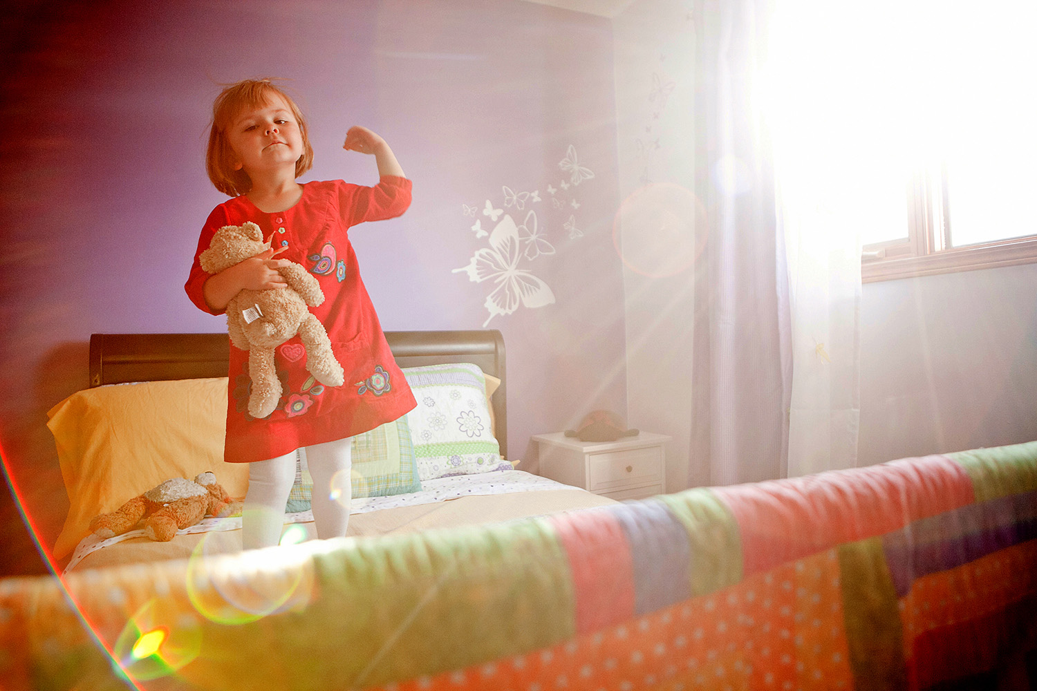 Strong Girl in the sunlight in her bedroom