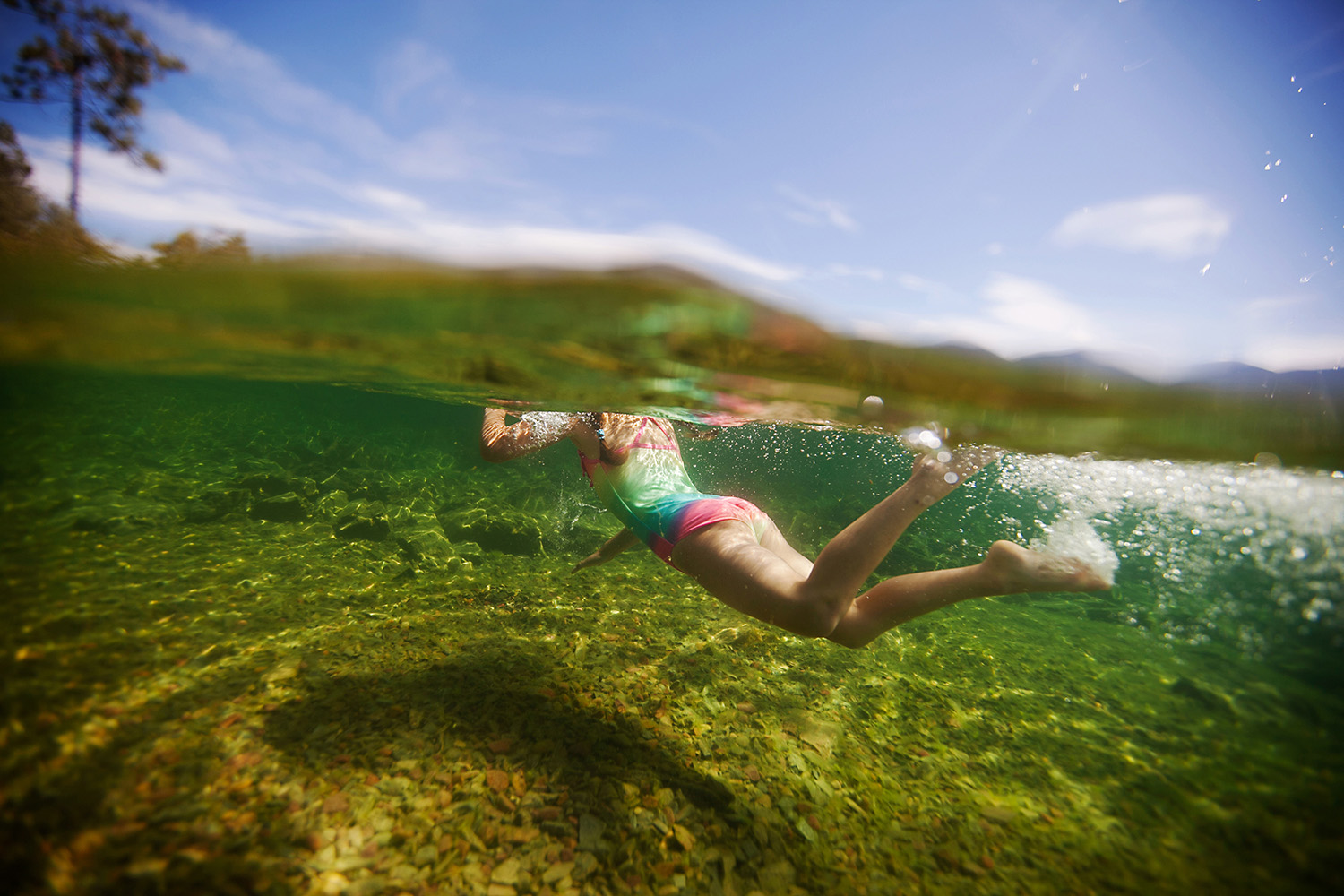 child swimming in Flathead Lake in Montana