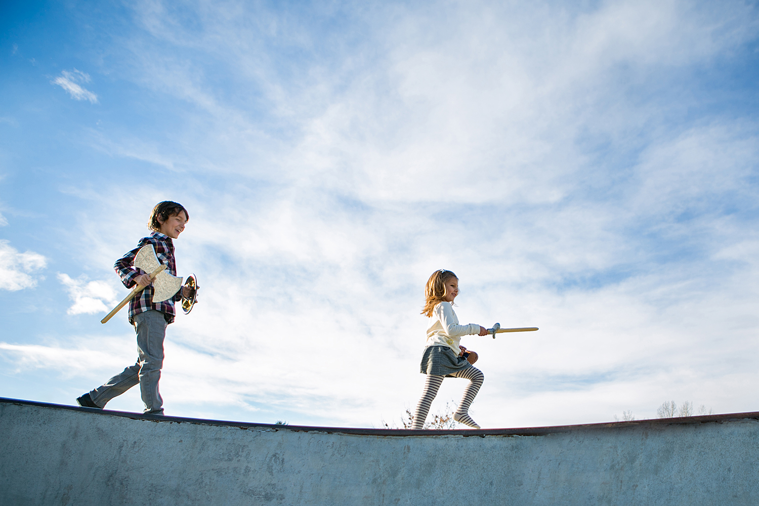 Two children pretending to be soldiers