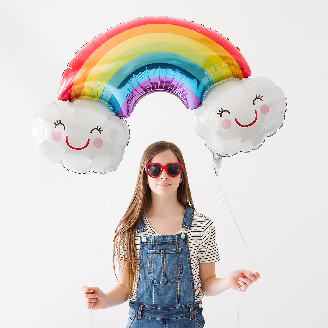 Teen girl with rainbow balloon