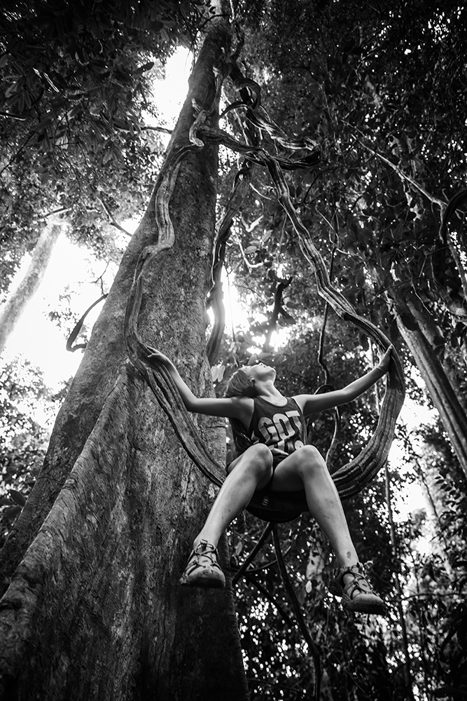 Swinging on a vine in Thailand