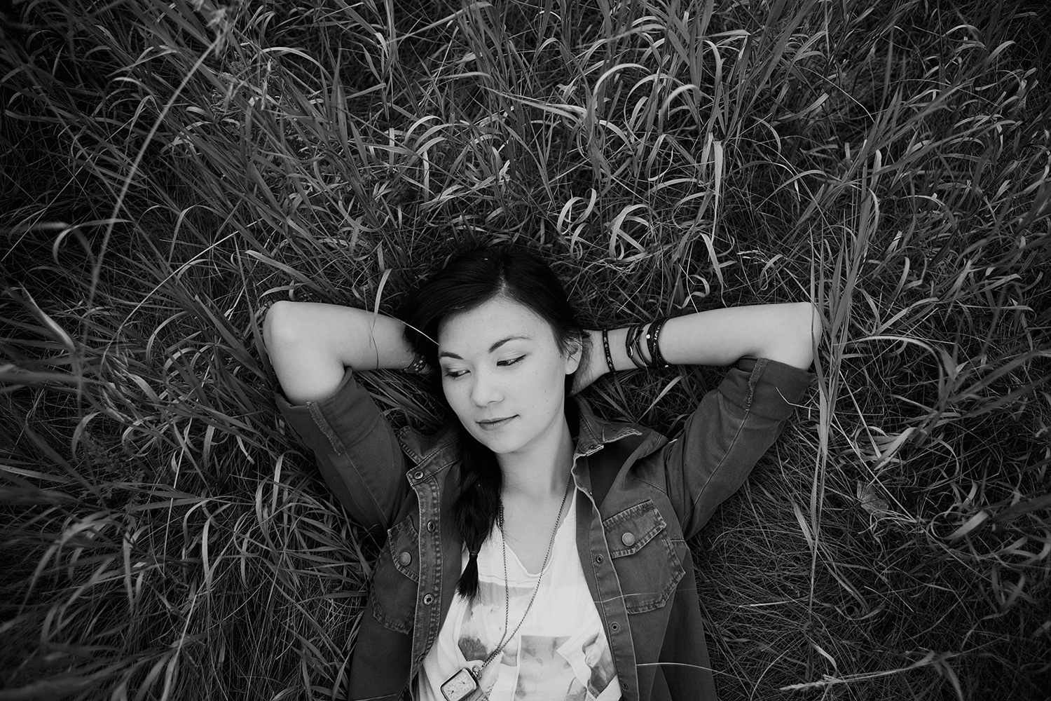 Contemplative teen in long grass