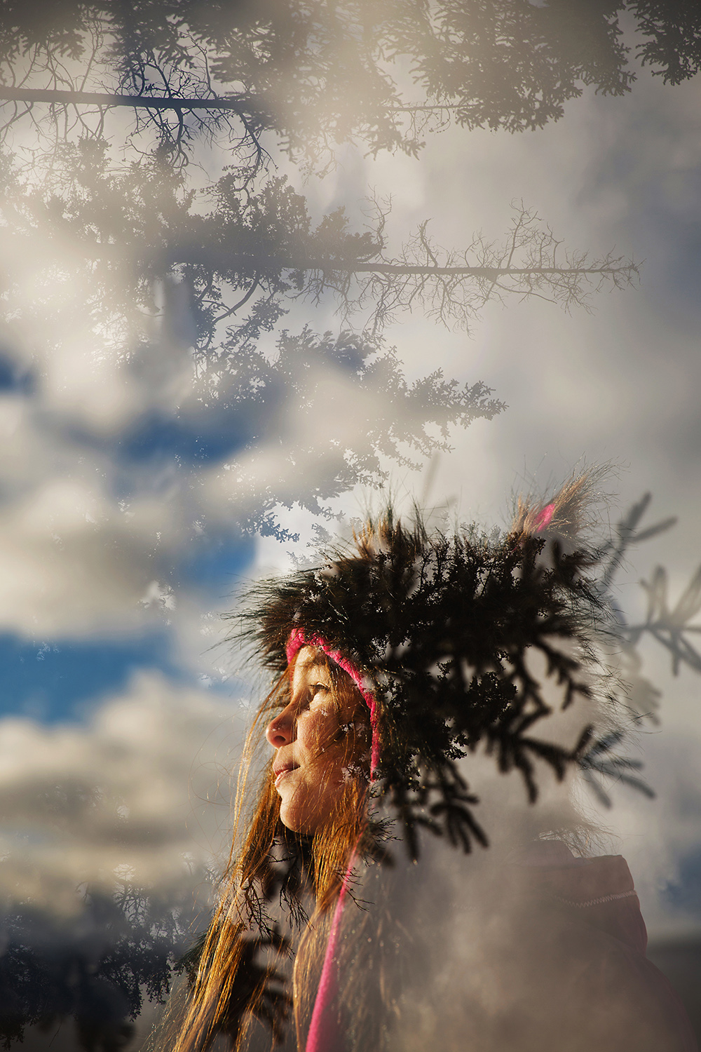 Double Exposure of a little girl and a winter skyline